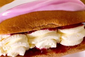 Schar sweet Brioche roll filled with jam and cream.