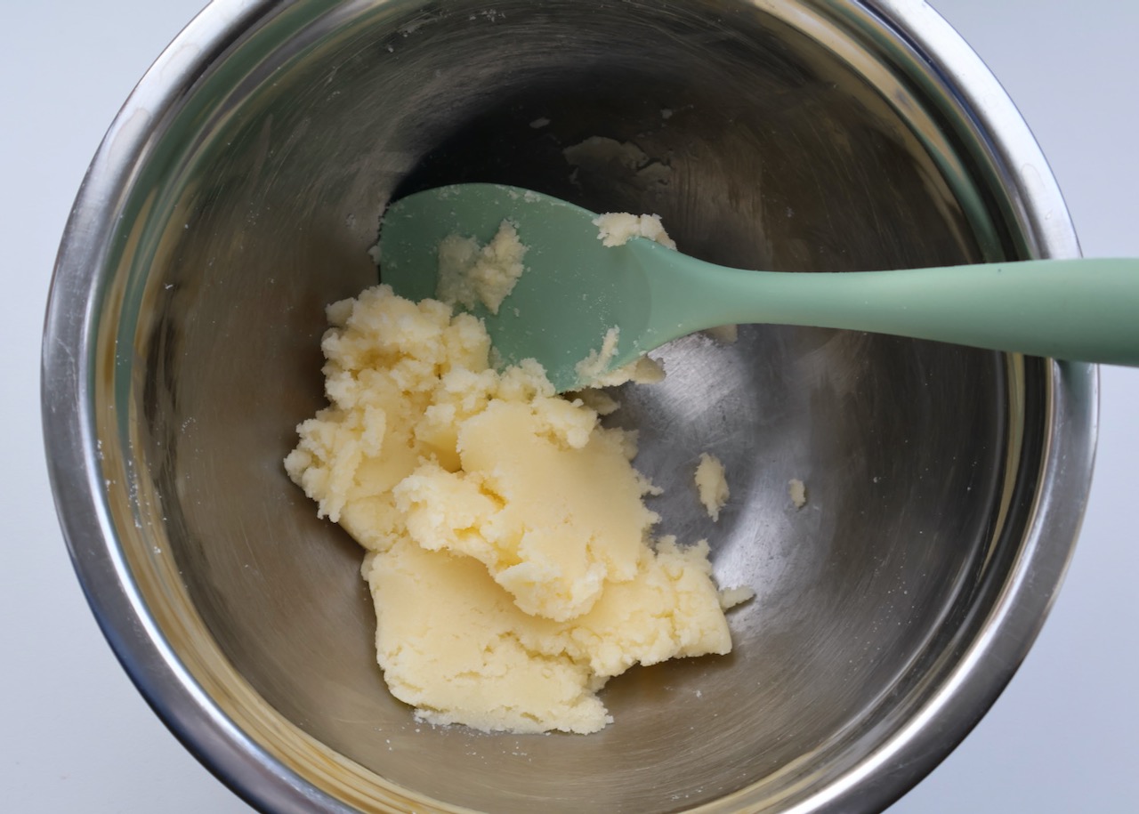 Butter and sugar creamed together in a stainless steel bowl