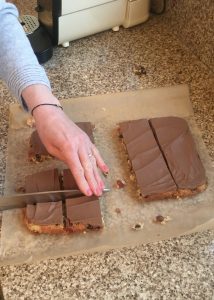 Slicing chocolate picnic slices