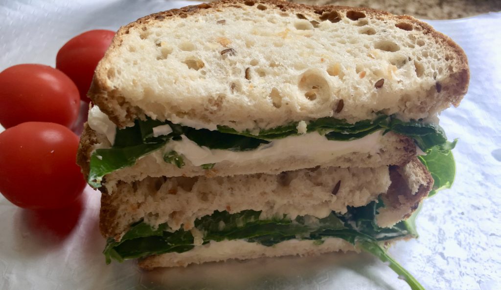 Gluten free sandwich - soft cheese and spinach on seeded bread