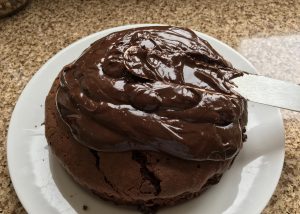 Gluten free chocolate cake topped with ganache