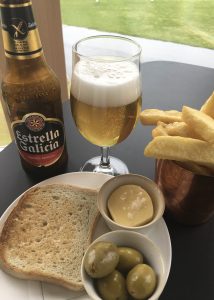 Gluten free chips, bread, olives and beer