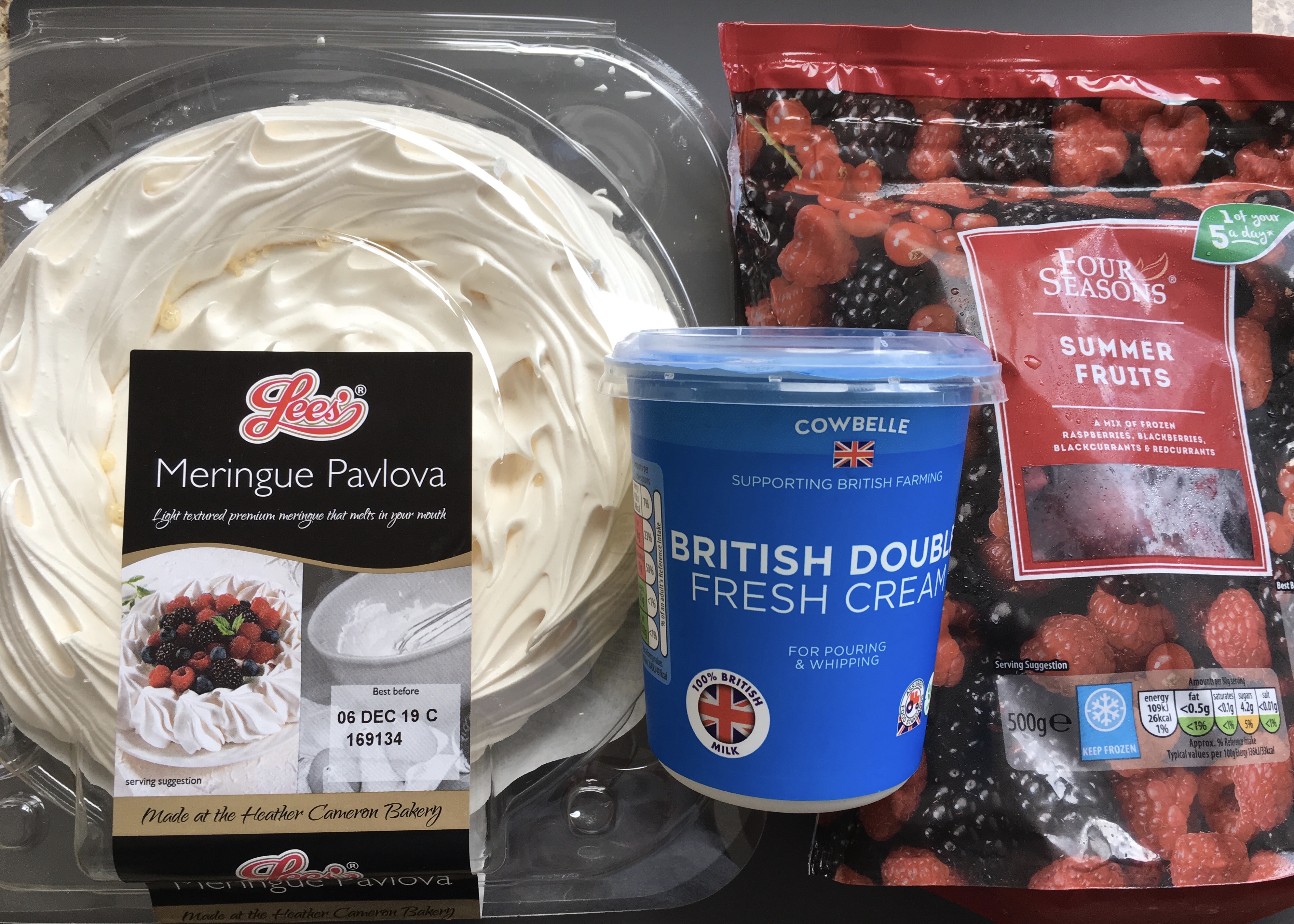 Lees Meringue pavlova, fresh double cream and frozen summer fruits all from Aldi.
