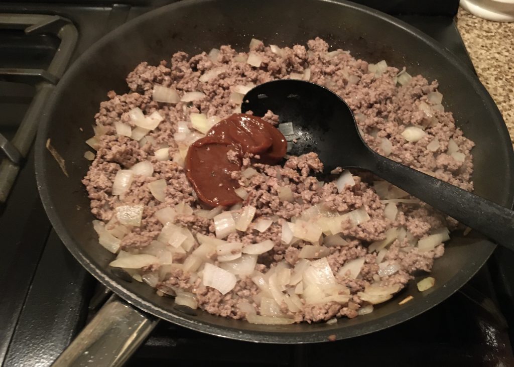 Browned mince beef and onion in a deep frying pan