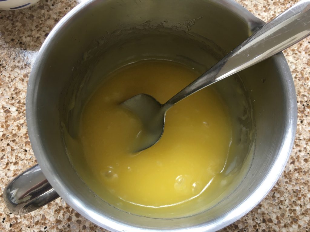 Melted sugar and butter in a saucepan. Ingredients for gluten free lemon drizzle cake. 