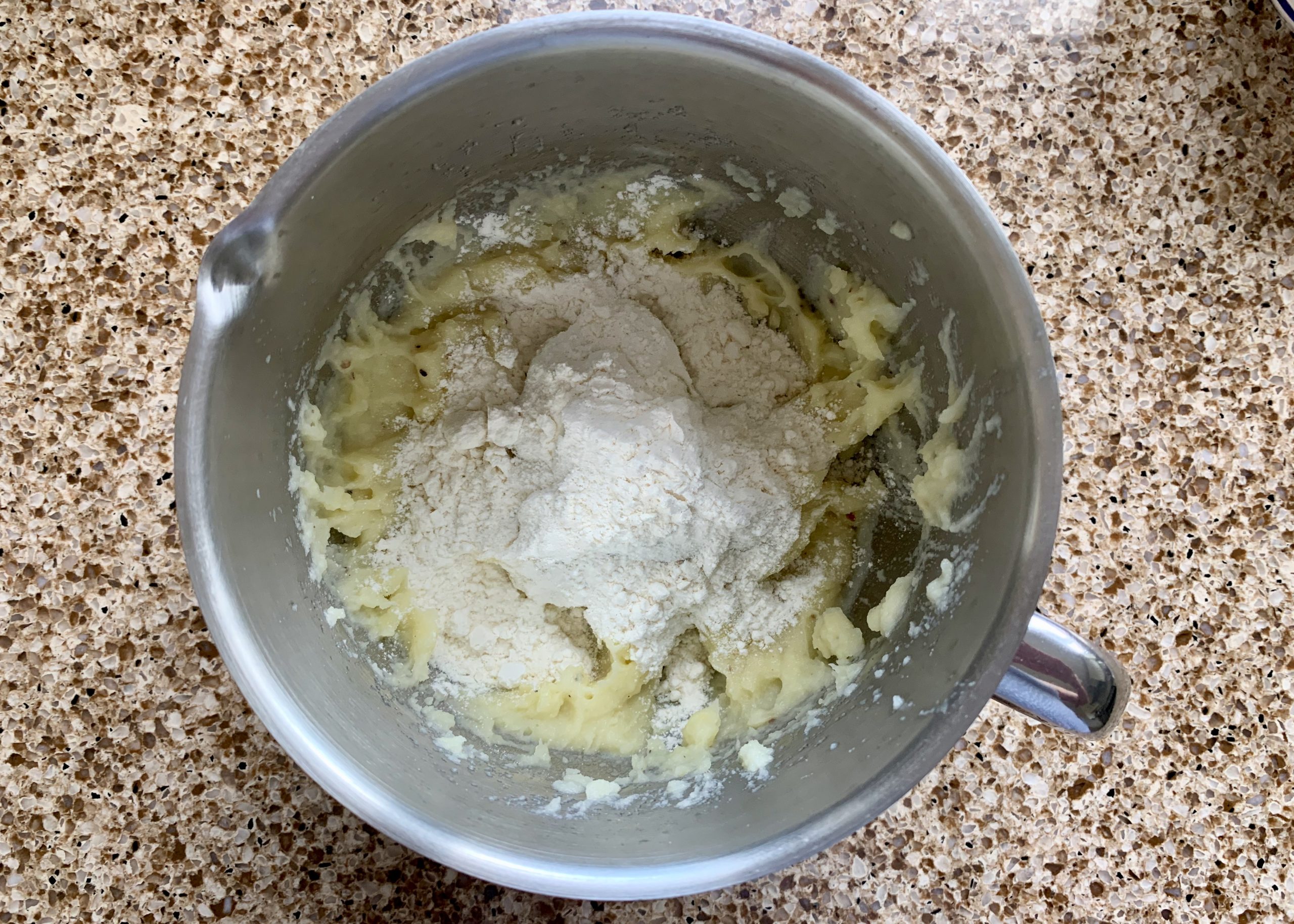 Mashed potato and flour in a pan