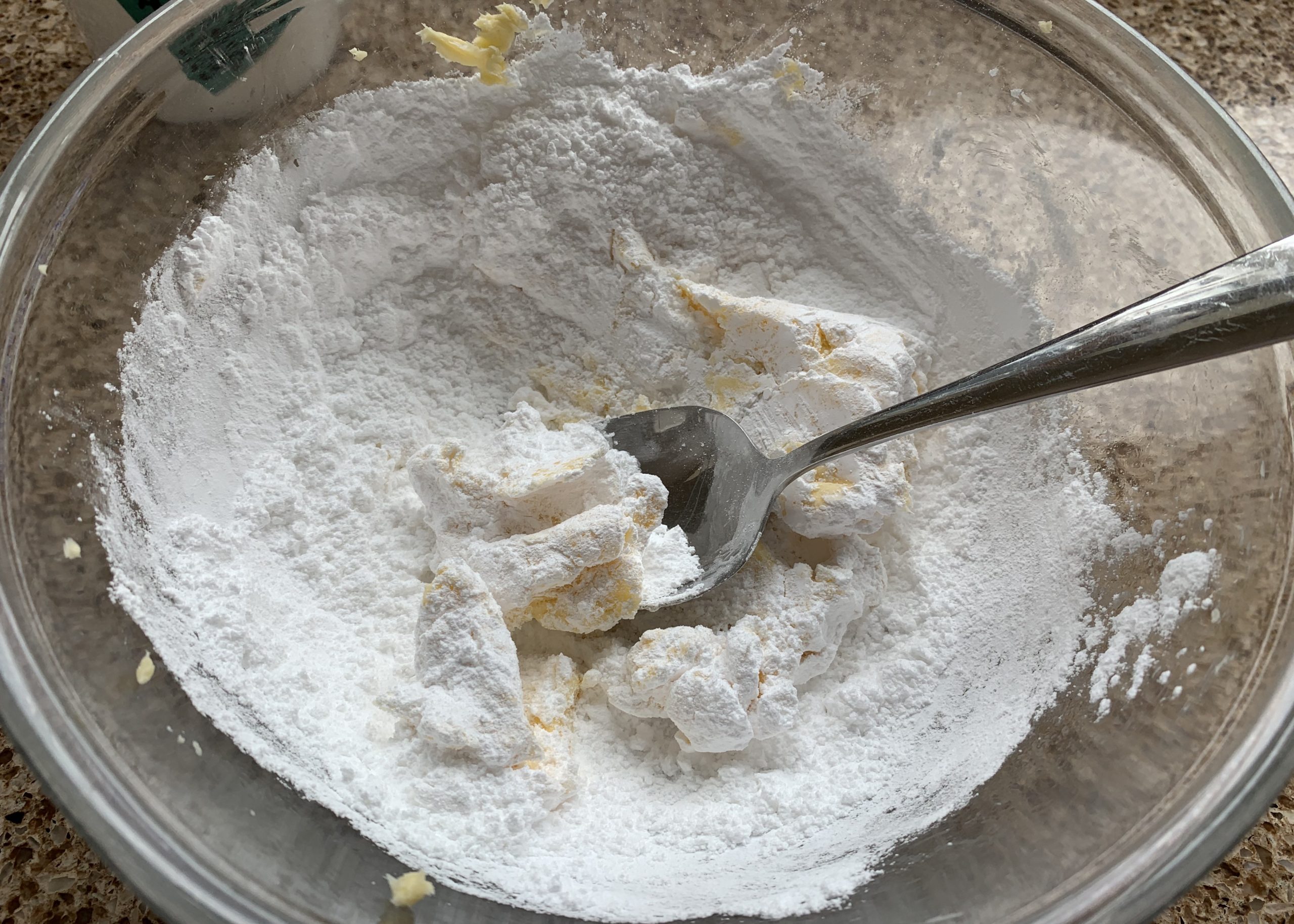 Icing sugar and butter in a bowl for buttercream