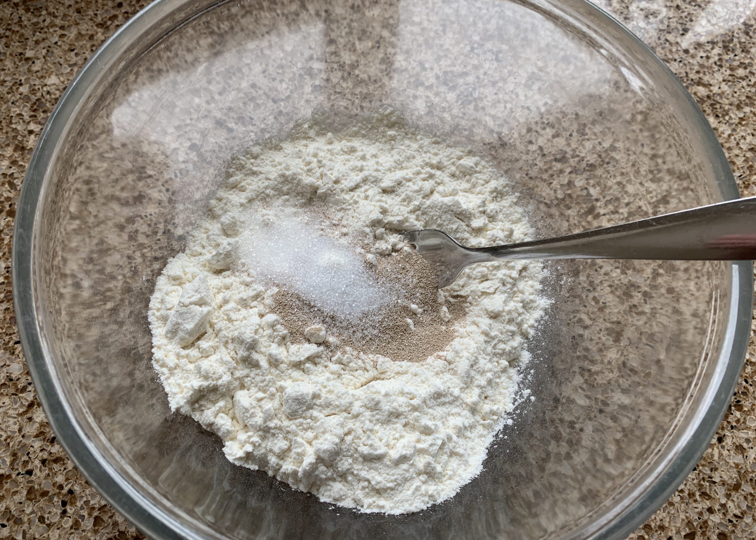 Gluten free flour, sugar and yeast in a bowl