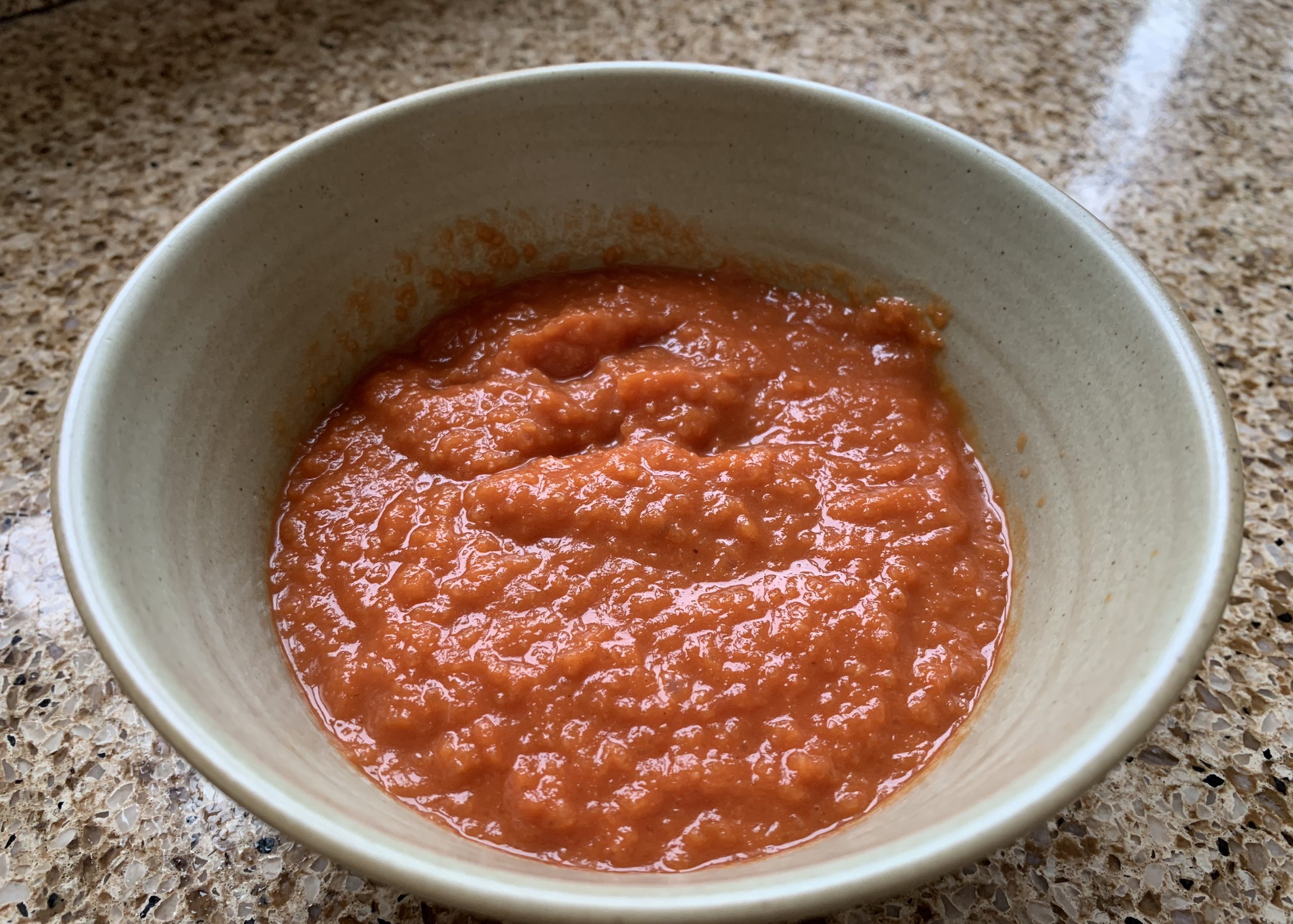 Tomato sauce in a bowl for gluten free pizza