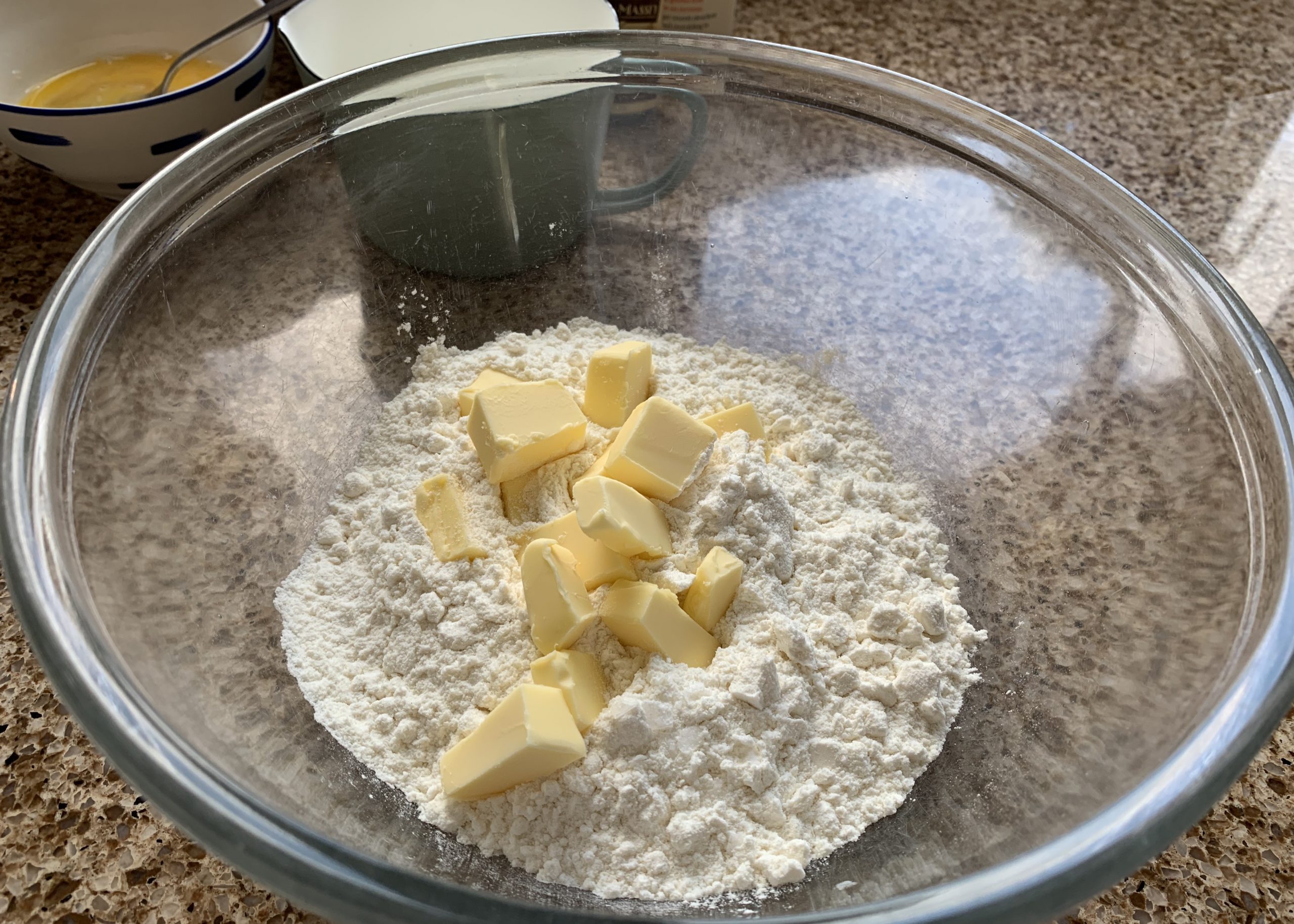Gluten free flour and butter in a large glass mixing bowl