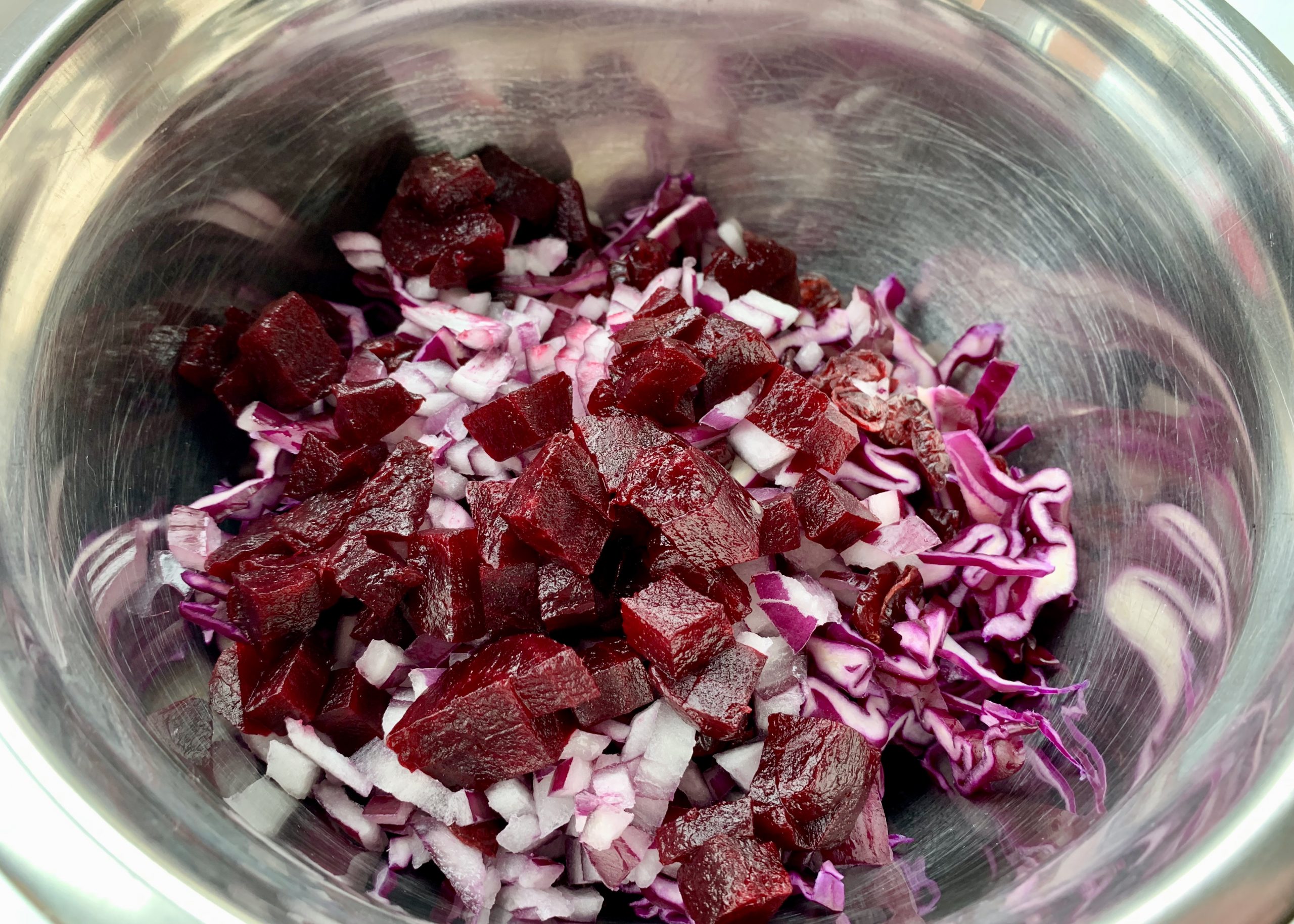 Ingredients in a mixing bowl for red slaw