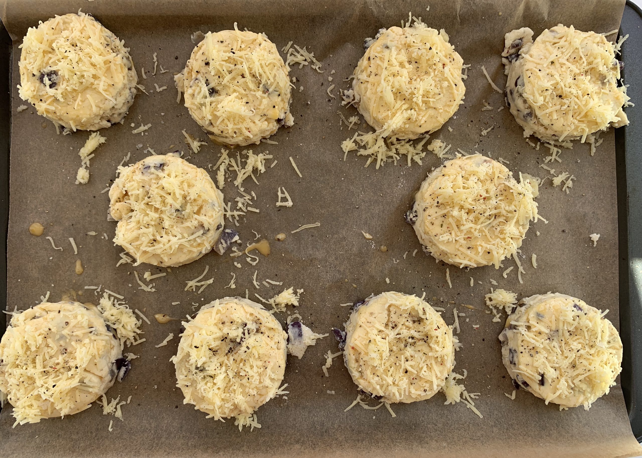 Gluten free cheese and red onion scones sprinkled with cheese - not baked 
