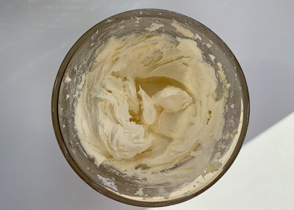 Vanilla buttercream in a pyrex bowl