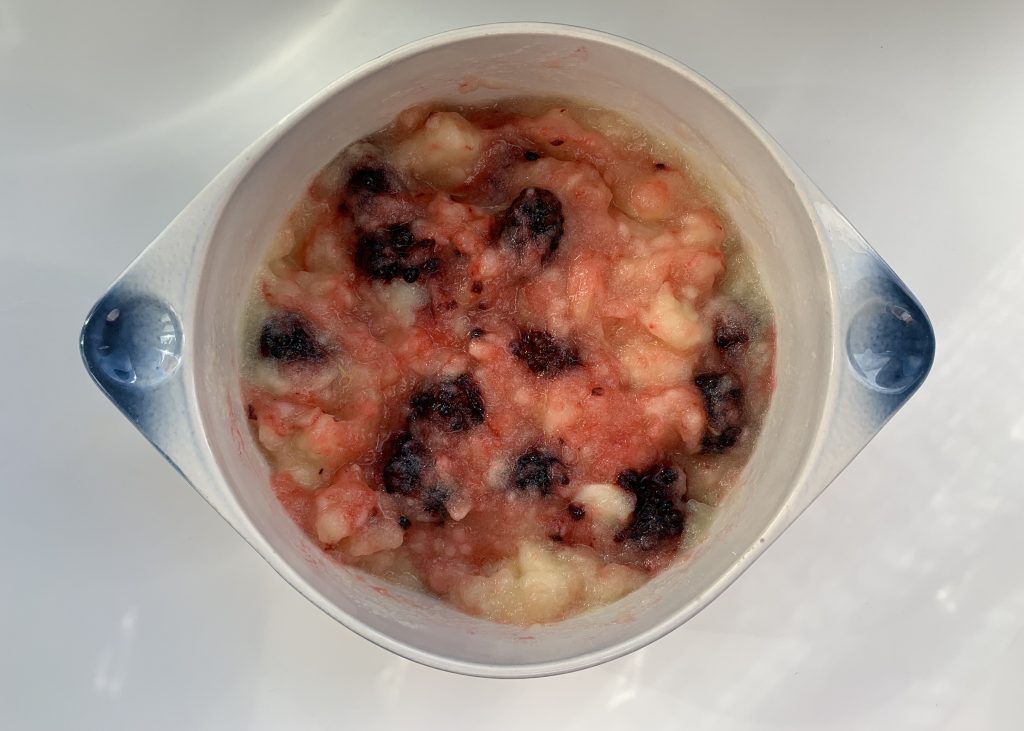 Blackberries and stewed apples mixed together in an ovenproof dish