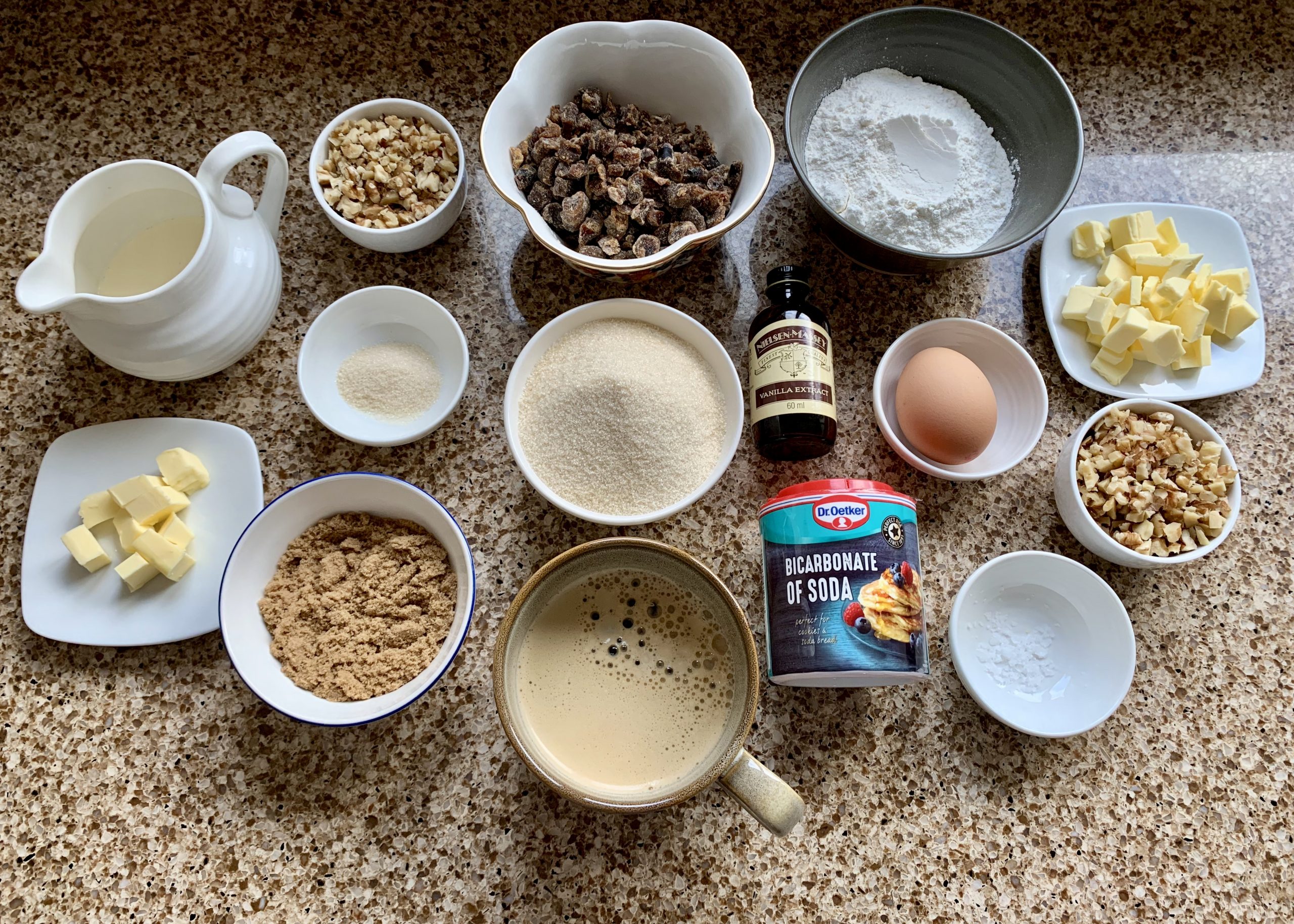 Flatlay of ingredients needed to make a sticky toffee pudding