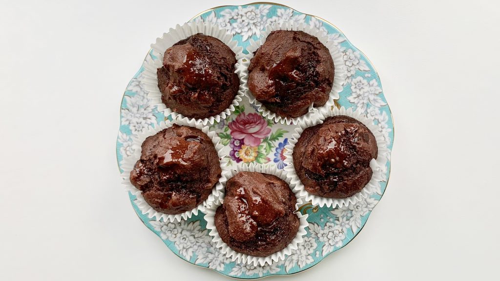 Gluten free banana chocolate muffins on a floral china plate