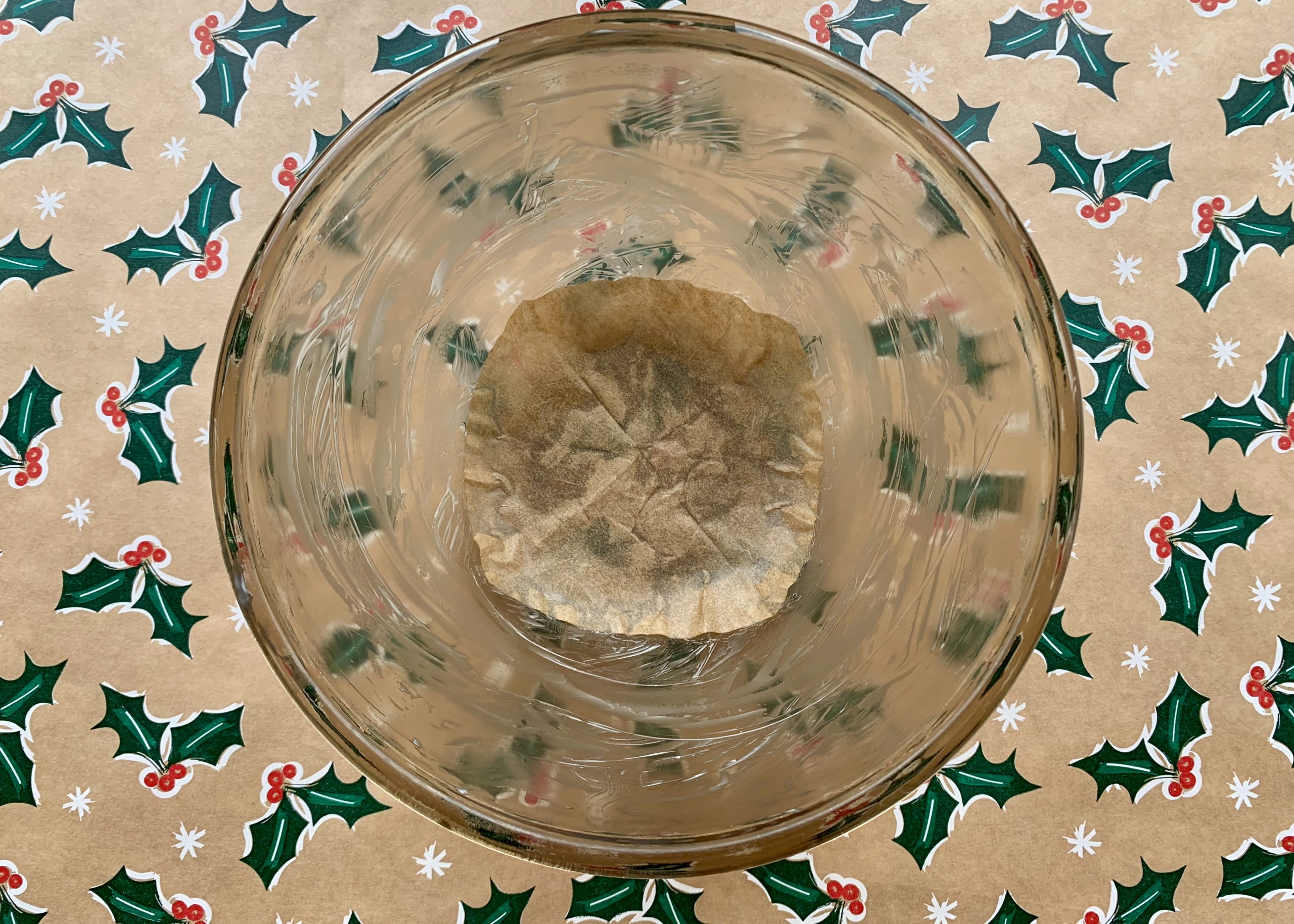 Buttered pyrex dish with a disk of greaseproof paper on the bottom