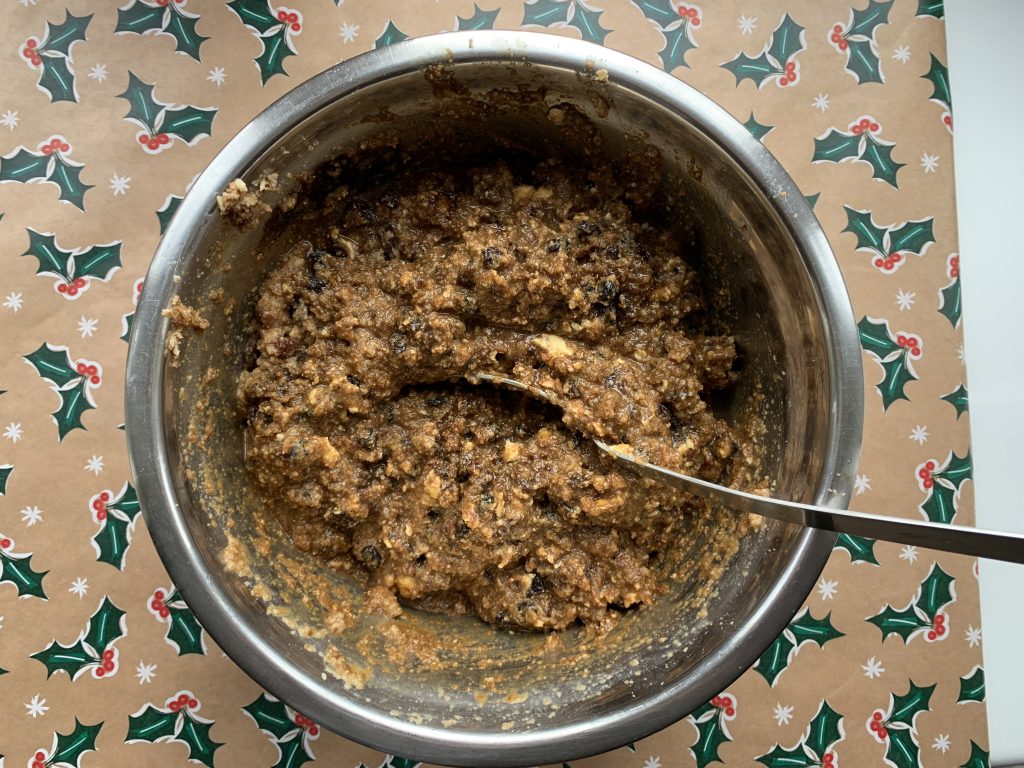 Mixture for gluten free Christmas pudding in a stainless steel bowl