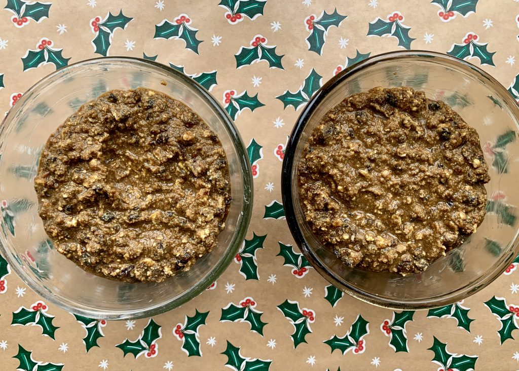 Gluten free Christmas pudding mixture divided between two pyrex bowls