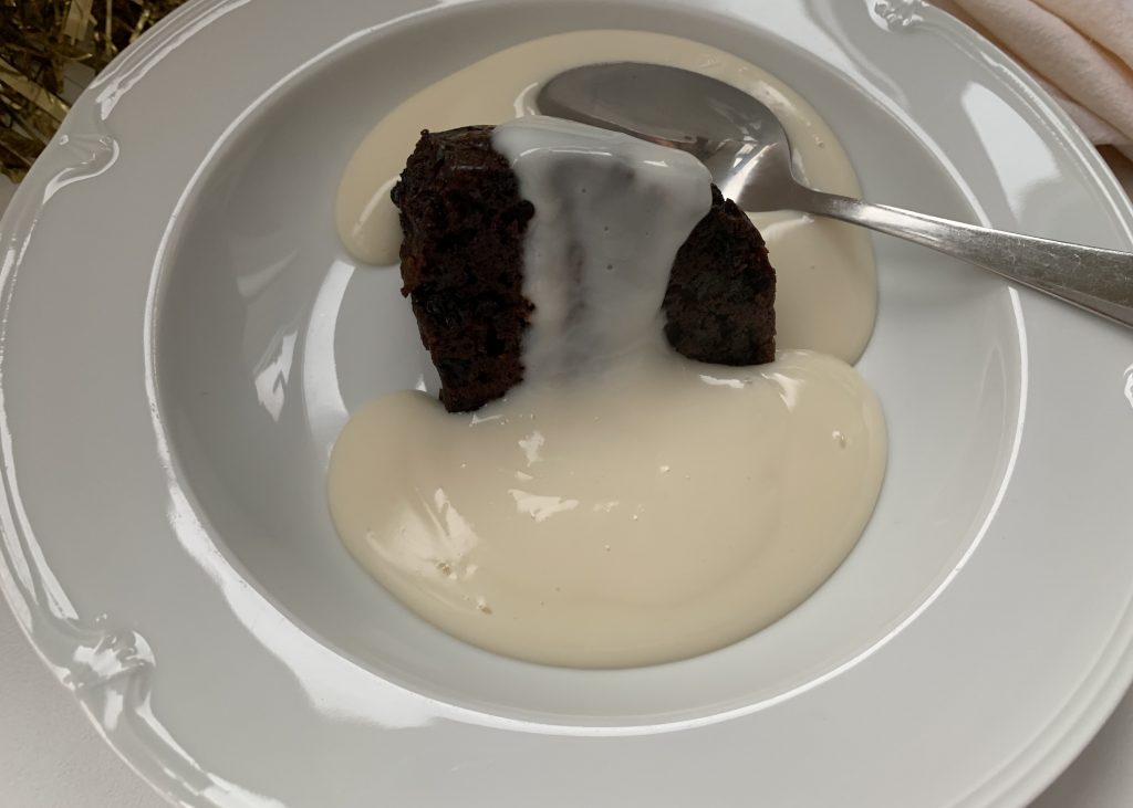 Gluten free Christmas pudding with brandy sauce