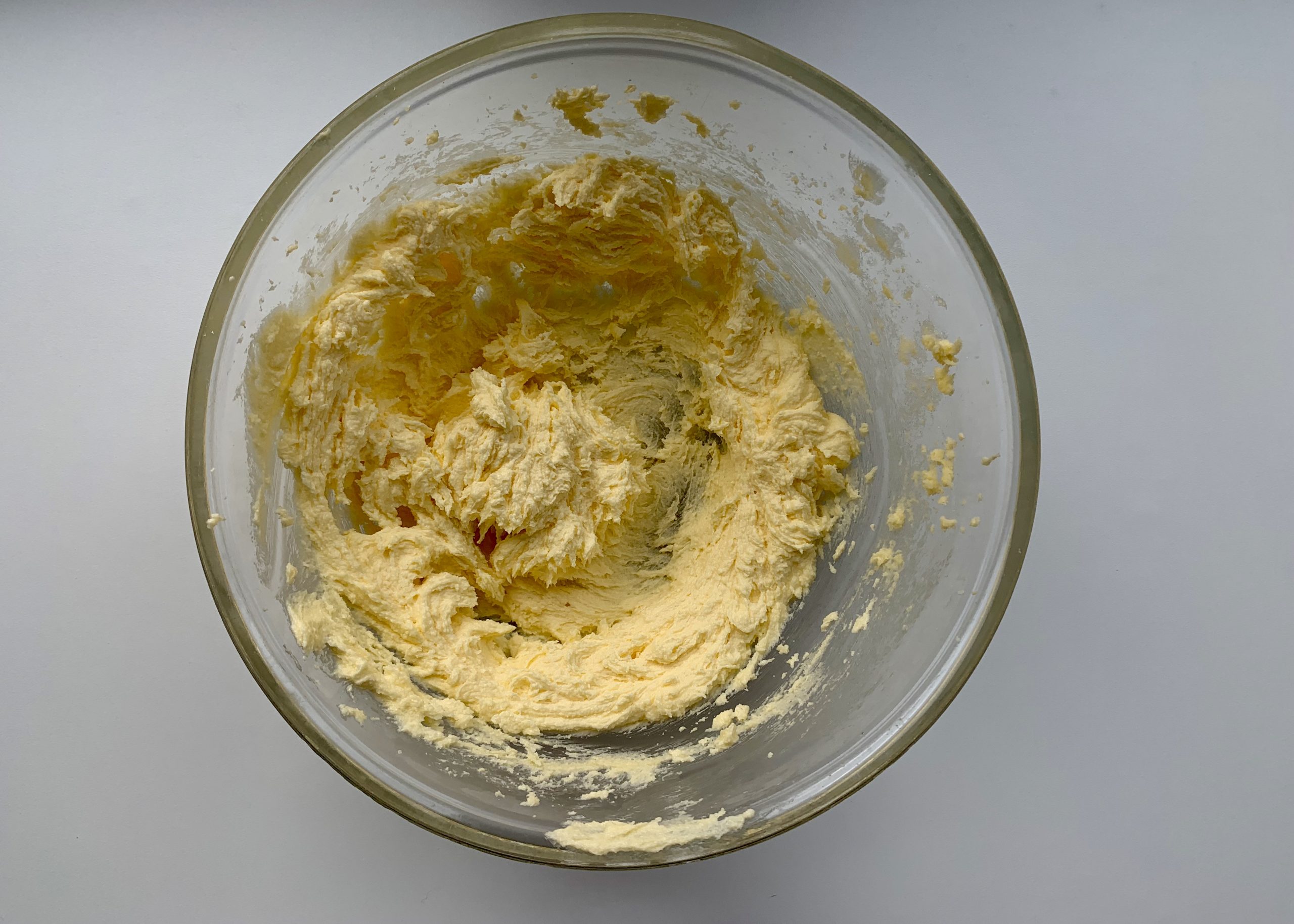 Creamed butter, margarine and sugar in a large pyrex mixing bowl