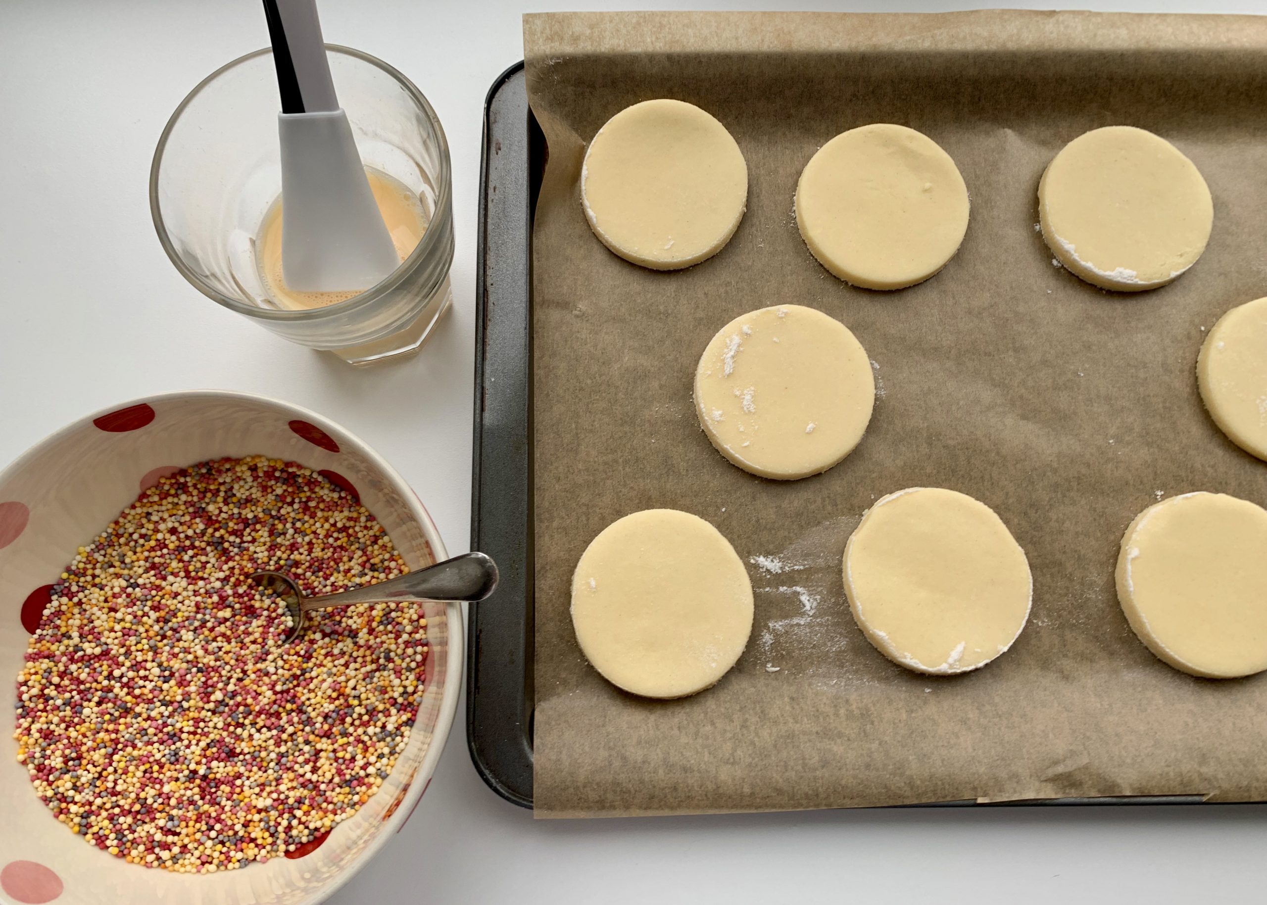 Gluten free Mexican cookies on a tray prior to having sprinkles added