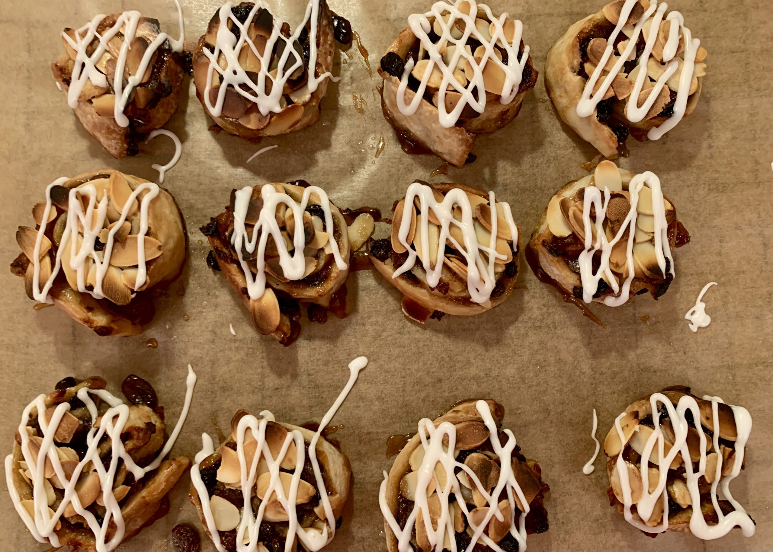 Gluten free mincemeat, cherry and almond swirls drizzled with glace icing
