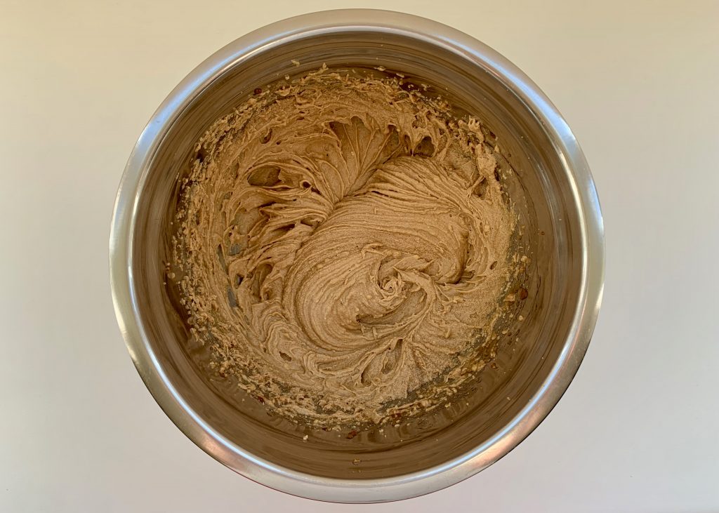 Wet mixture in a stainless steel bowl for ginger biscuits