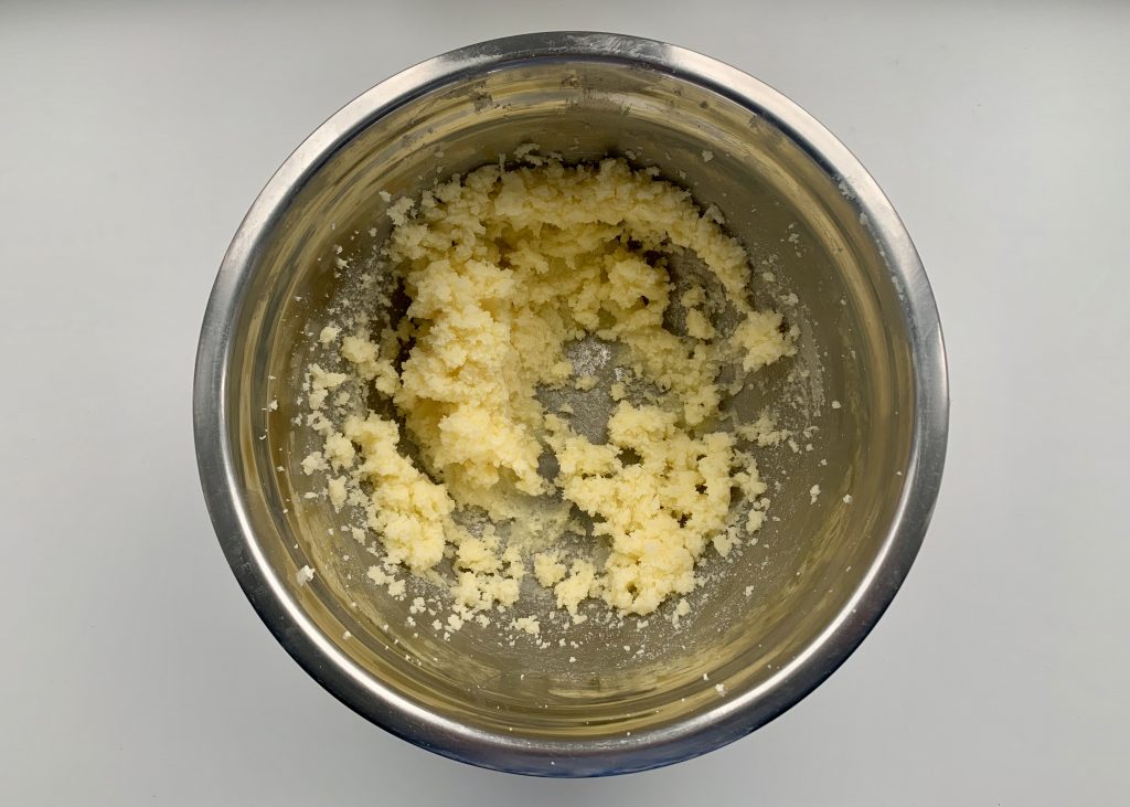 Creamed butter and sugar in a stainless steel bowl