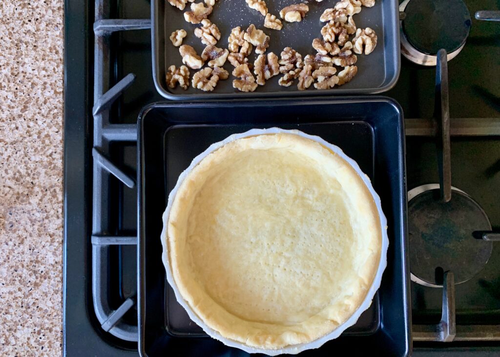 Blind baked gluten free pastry base and walnuts