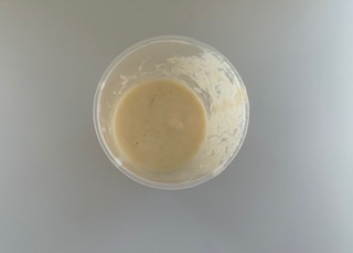 Buttermilk, beaten egg and vanilla extract in a container
