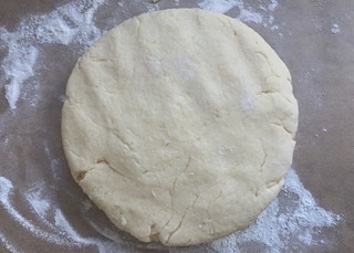 Gluten free scone dough patted out on a gf floured worktop
