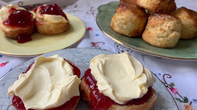 Gluten free scones topped with strawberry jam and clotted cream