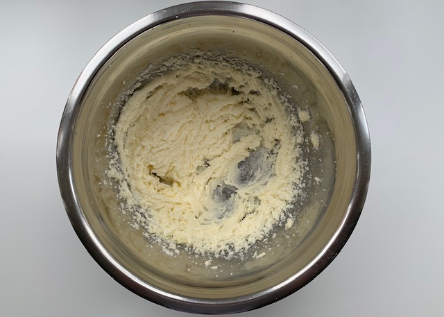 Butter and sugar mixed together in a bowl