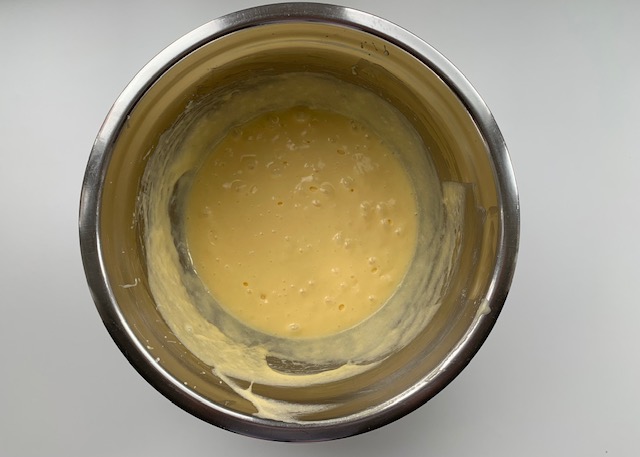 Butter, sugar and eggs in a stainless steel bowl