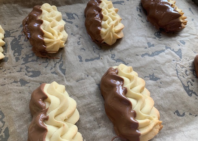 Gluten free Dutch shortcake biscuits dipped in melted chocolate