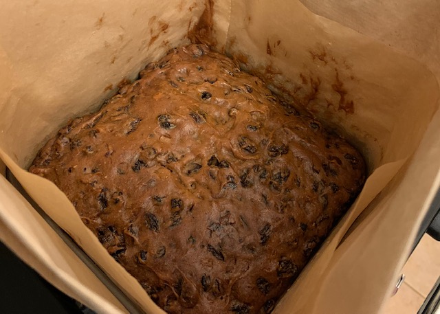 Gluten free Christmas cake freshly baked and brushed with brandy