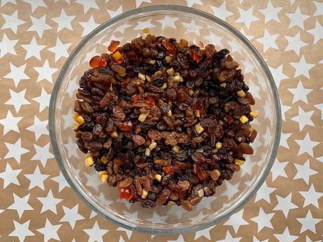 Mixed dried fruit in a large glass bowl