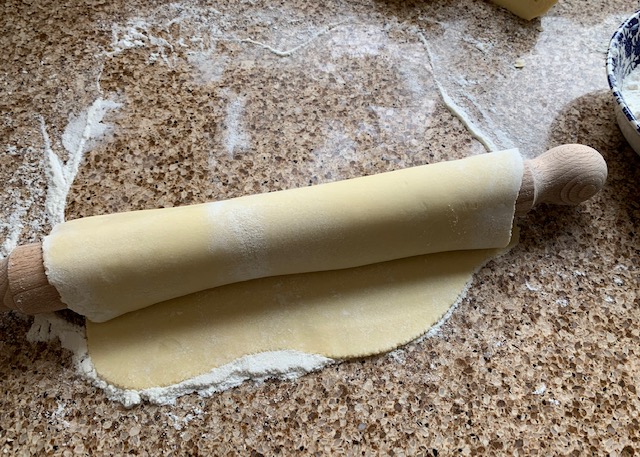 Gluten free pastry wrapped around a rolling pin