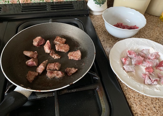 Diced beef in a frying pan
