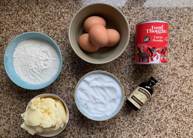 Flatlay of ingredients for a chocolate cake