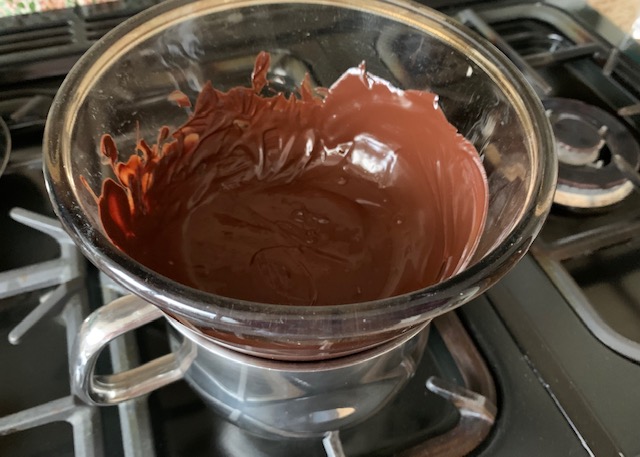 Melted chocolate in a pyrex bowl