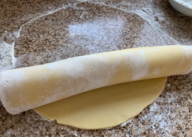 Gluten free sweet pastry wrapped around a rolling pin