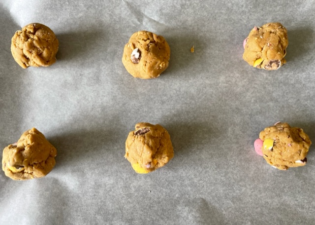 Balls of gluten free Easter cookie dough on a tray