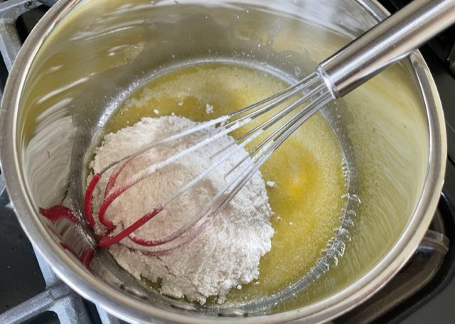 Melted butter and gluten free flour in a pan