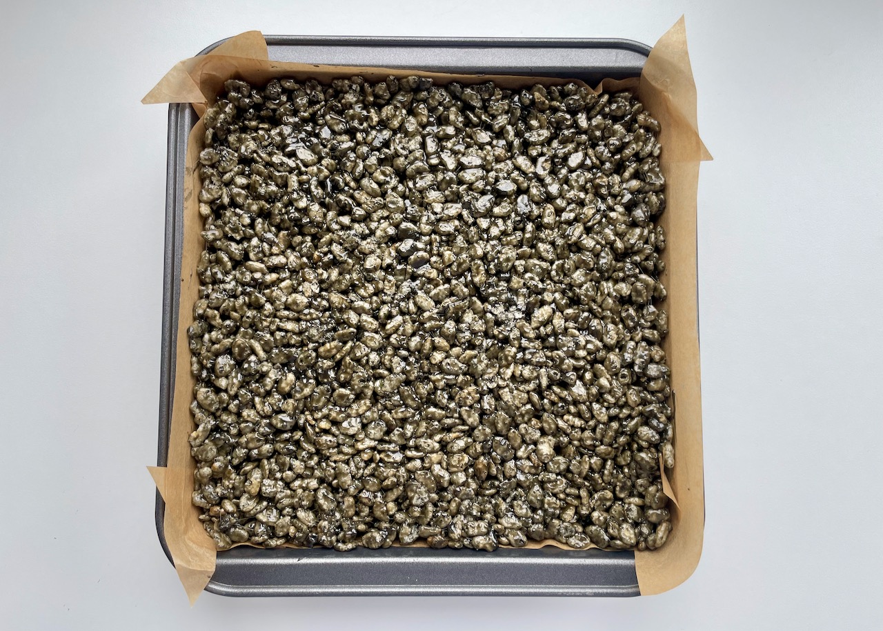 Gluten free liquorice crispy squares before being cut into squares