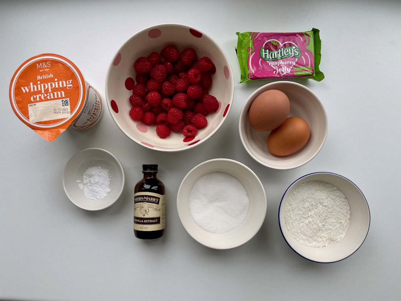 Flat-lay of ingredients needed to make raspberry Royale deserts.