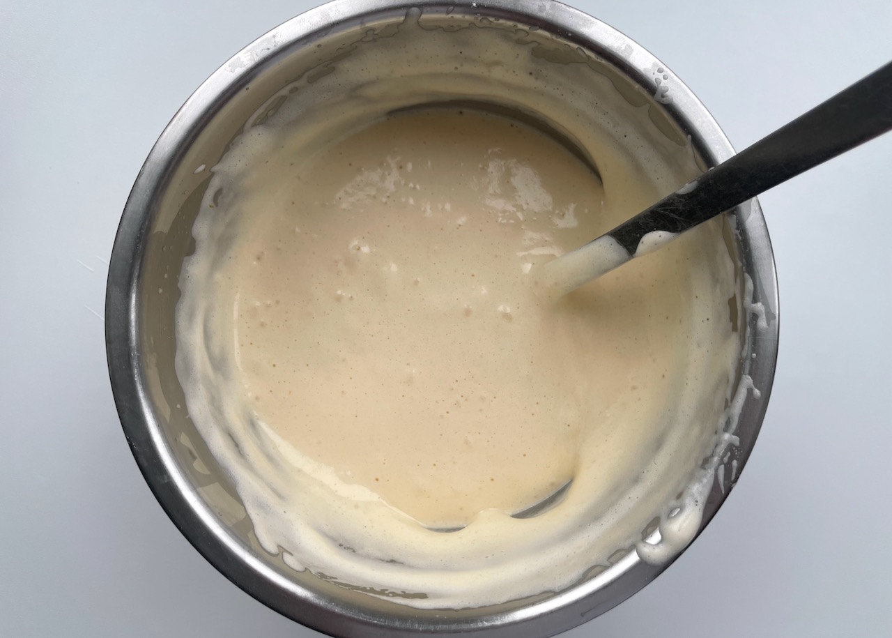 Gluten free fatless sponge mixture in a stainless steel bowl
