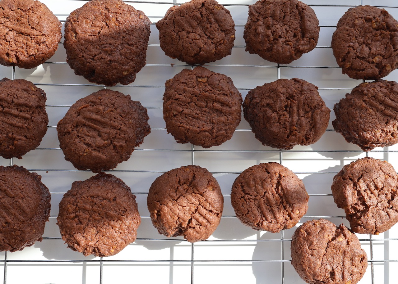 Gluten free chocolate biscuits cooling on rack